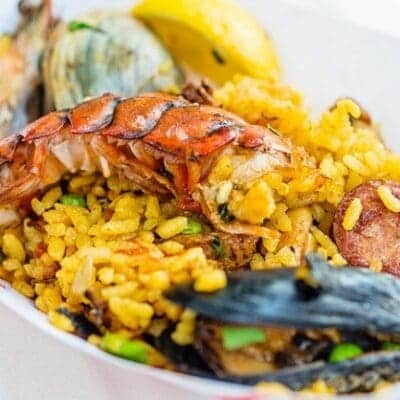 Paella di carne e pesce ricetta originale spagnola con ingredienti e dosi per fare Paella mista con cozze e chorizo
