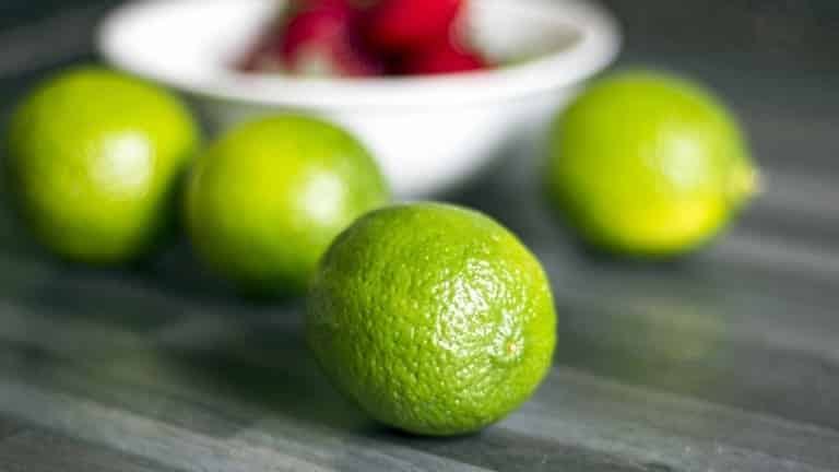 Limes. The best cocktail made with fresh lime. Making strawberry caipirinha