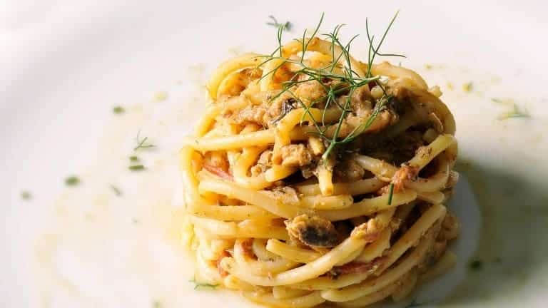 Bucatini with sardines fennel, pine nuts and raisins, Sicilian recipe, Italian