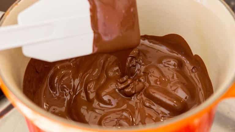 Melted chocolate to make whisky and chocolate truffles, easy dessert recipes