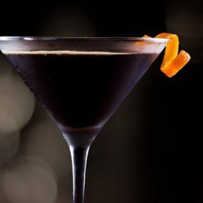 Black Mirror cocktail, Italian aperitif made with grappa, vermouth nocino saba