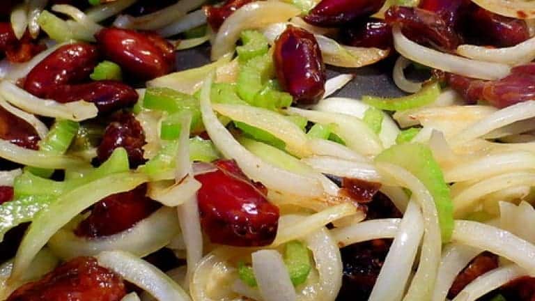 Onions, dates, celery chopped and sauteed to make a delicious stewed pork
