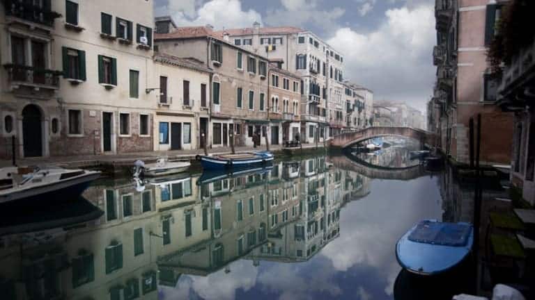 Venice: canal with a beatiful mirror effect. Veneto wine tour
