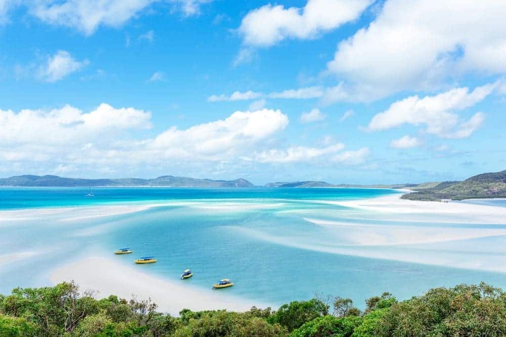 Crystal-clear waters embracing powdery white sand at Whitehaven Beach