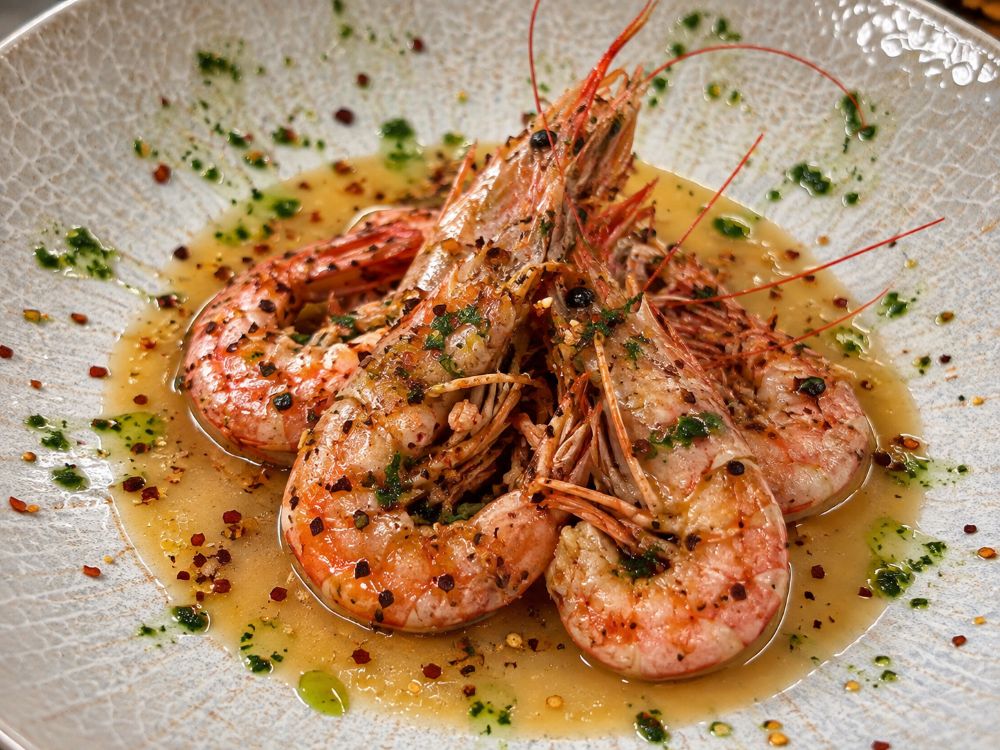 Where to eat the best spiced prawns in golden sauce in Lecco