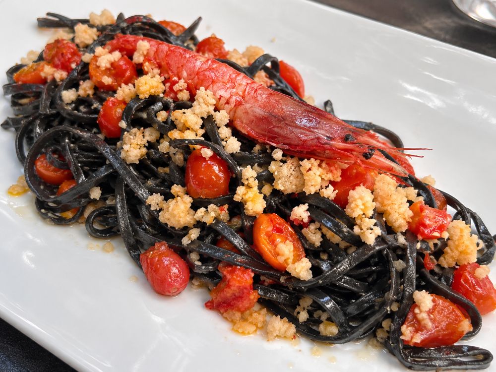 Squid ink linguine with red prawns